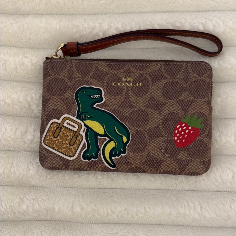Coach Brown Wristlet with Dinosaur and Strawberry Accents